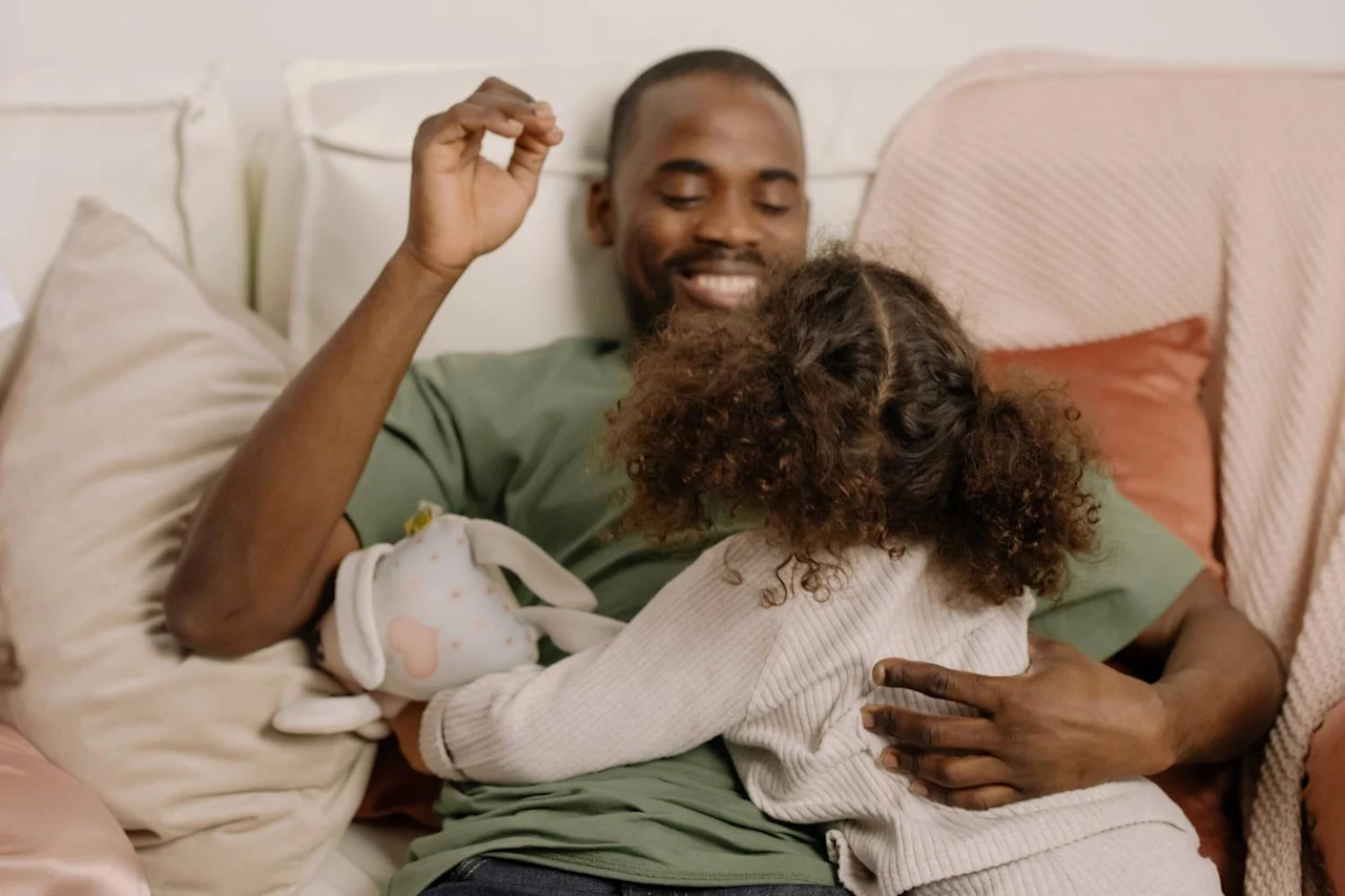 Man hanging out with daughter after figuring out which non-estate and cryptocurrency planning documents you should have.