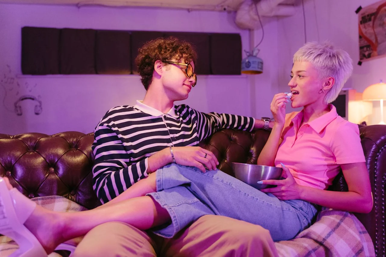 Couple relaxing in apartment after researching the differences between cohabitation agreement vs Will.