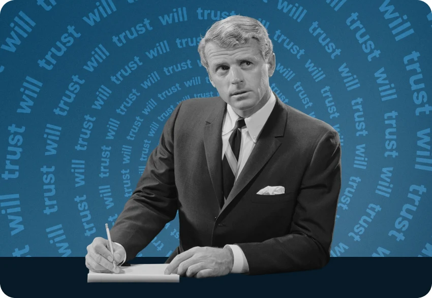Man in a suit signing a will and trust document