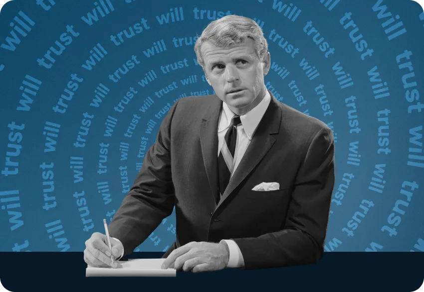 Man in a suit signing a will and trust document