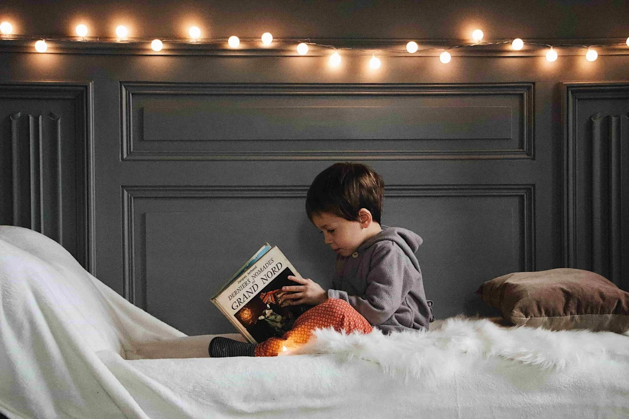 Child reading a book.