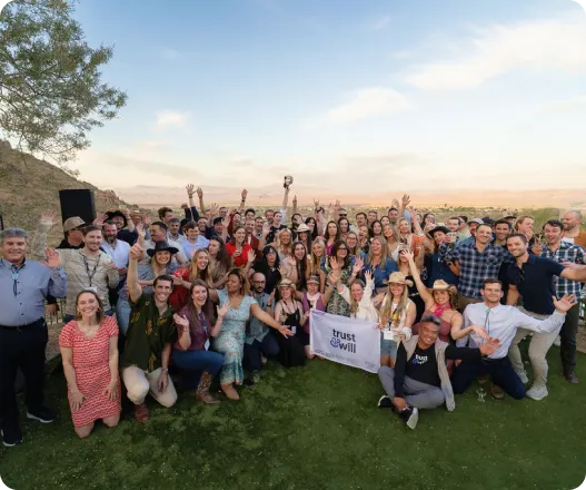 Company team celebrating together outdoors during a group event