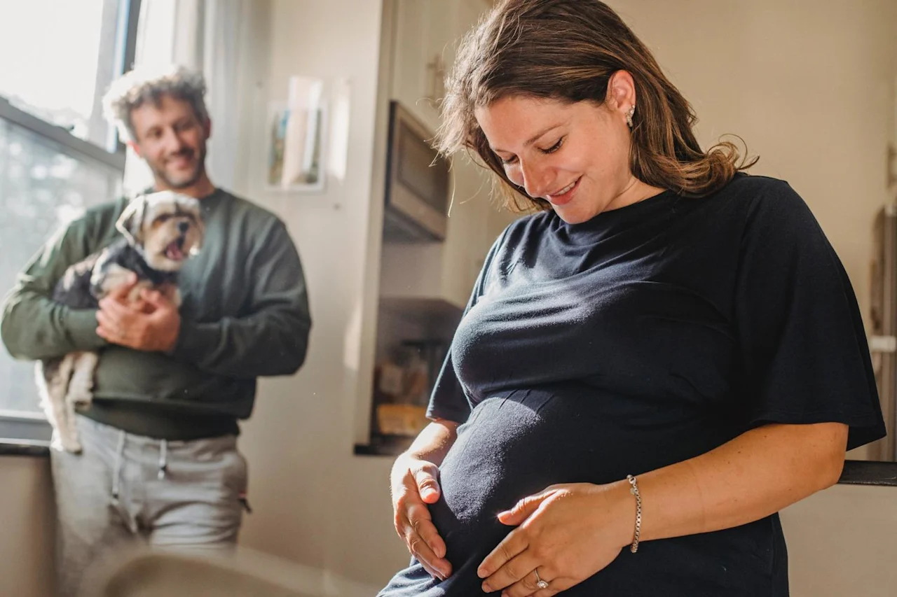 Pregnant woman with family after learning about bloodline planning.