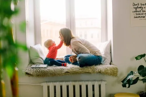Trust fund represented by mother playing with her child.