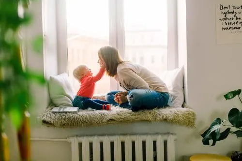 Trust fund represented by mother playing with her child.