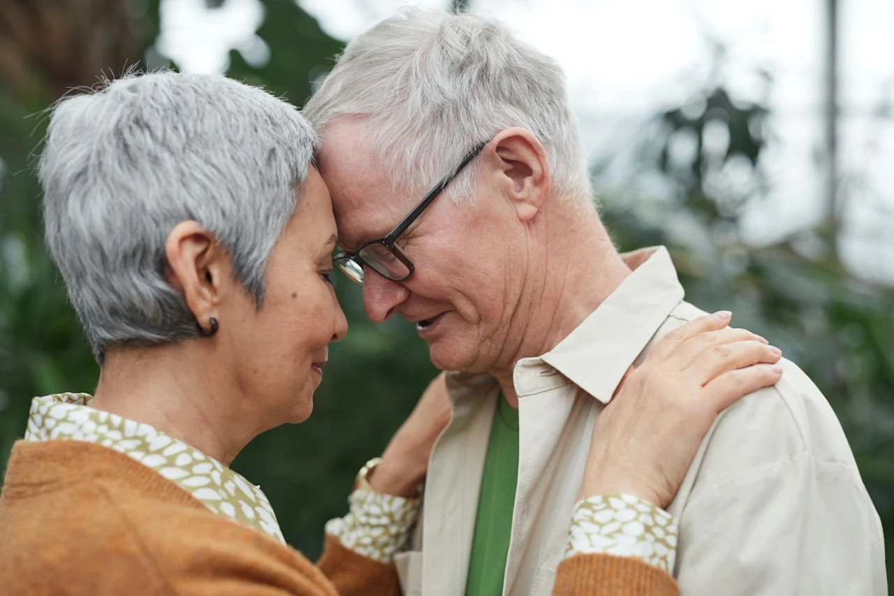 Couple embracing after discussing the differences between retirement planning and estate and cryptocurrency planning.