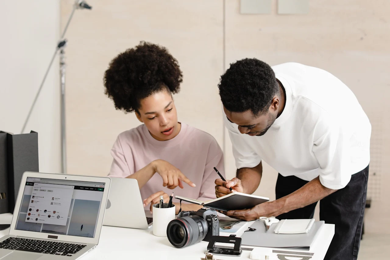 Coworkers collaborating together after their company implemented estate and cryptocurrency planning as en employee benefit.