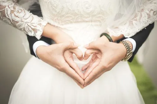woman-making-heart-shape-with-hands