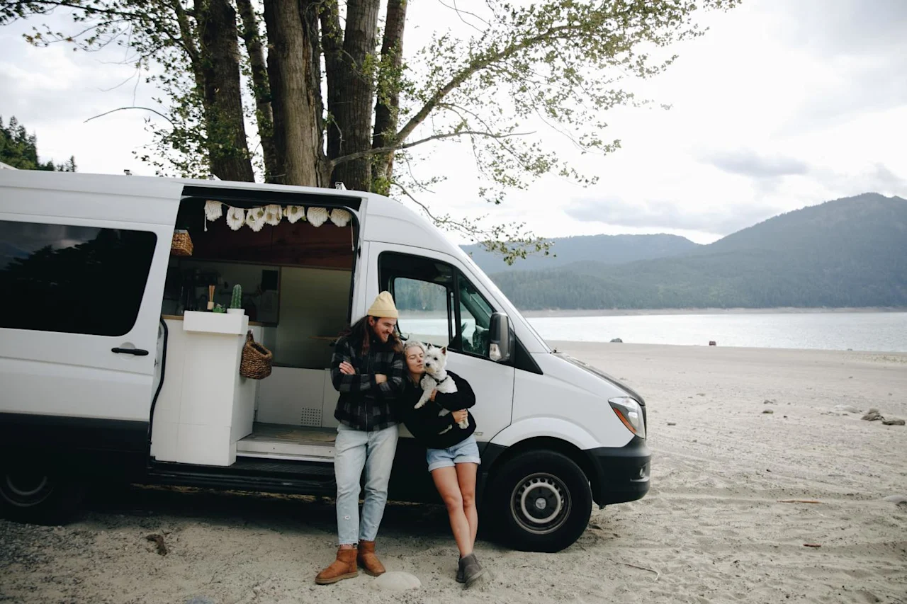 Couple enjoying van life after doing their research on remote digital nomads and estate and cryptocurrency planning.